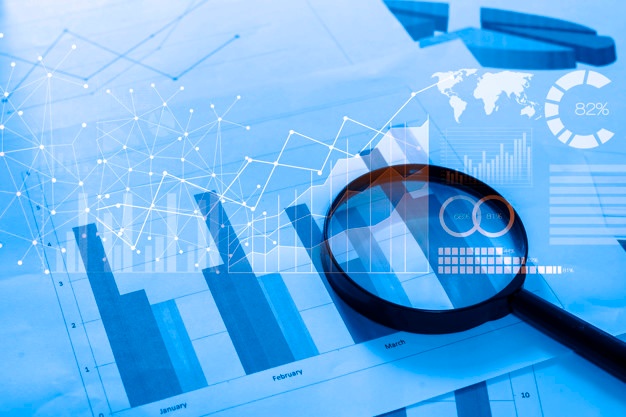 magnifying-glass-documents-with-analytics-data-lying-table_33799-219