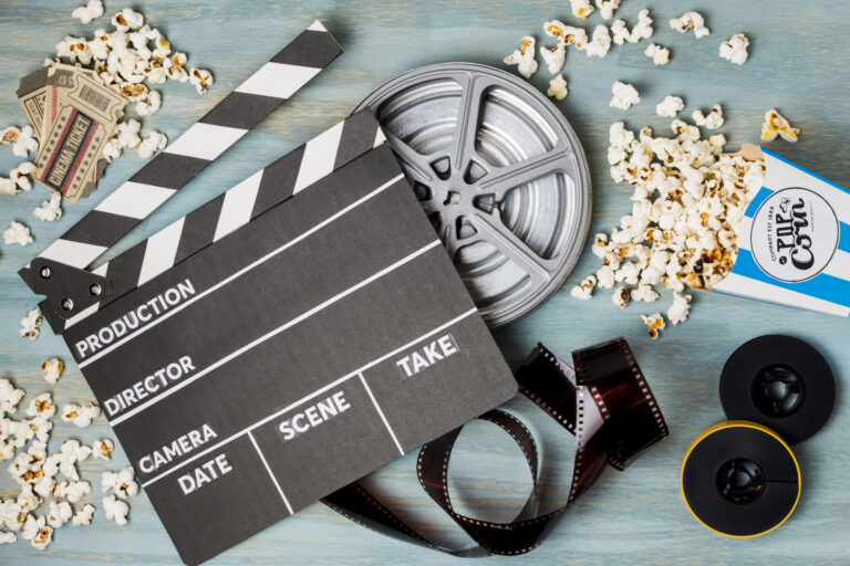 clapperboard-popcorn-film-stripe-cinema-tickets-wooden-desk